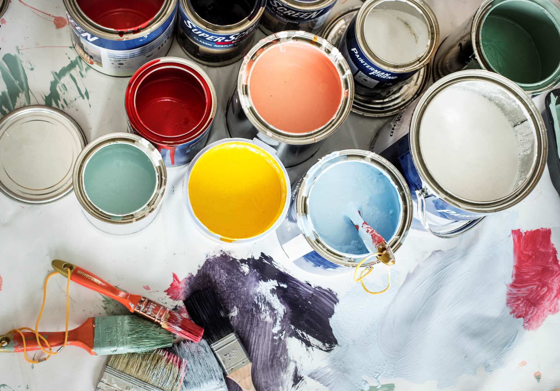 Paint cans on the floor | Featured image for the How to Choose Exterior Paint Colours to Elevate Your Home Blog by Renovare.